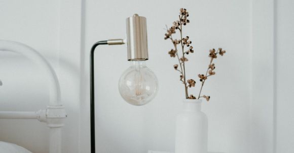 Bedside Table - A White Ceramic Vase on the Bedside Table