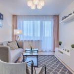 Curtains - Gray Fabric Padded Sofa and Glass-top Coffee Table Inside Living Room