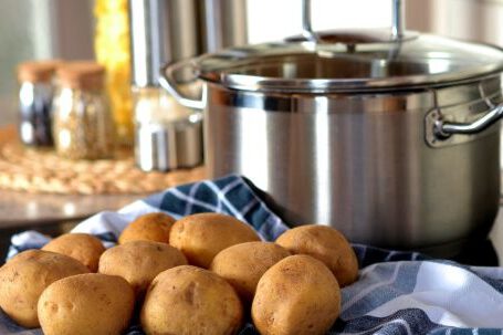 Cookware - Potatoes Beside Stainless Steel Cooking Pot